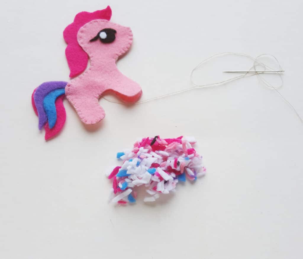 tiny felt scraps next to my little pony craft for kids