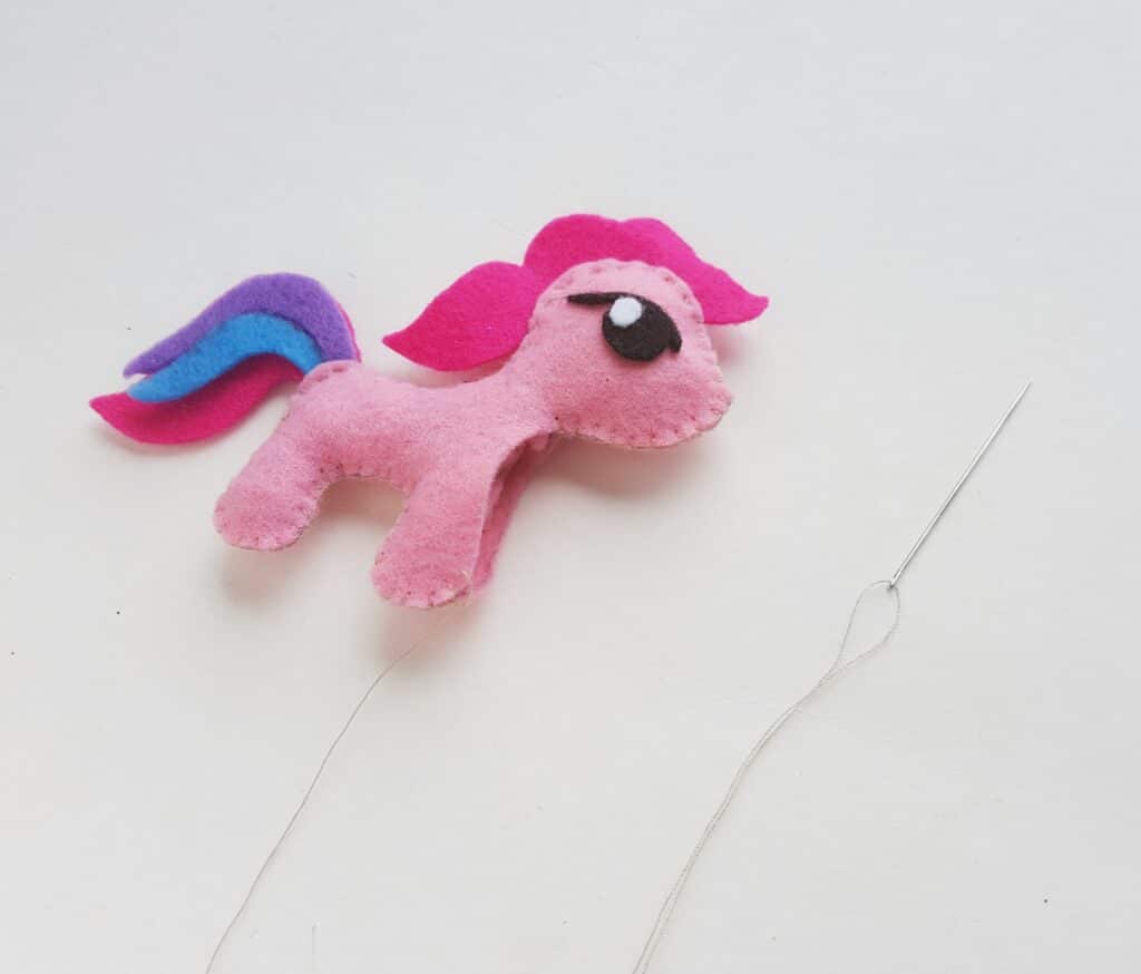 stuffed pink my little pony with needle and thread