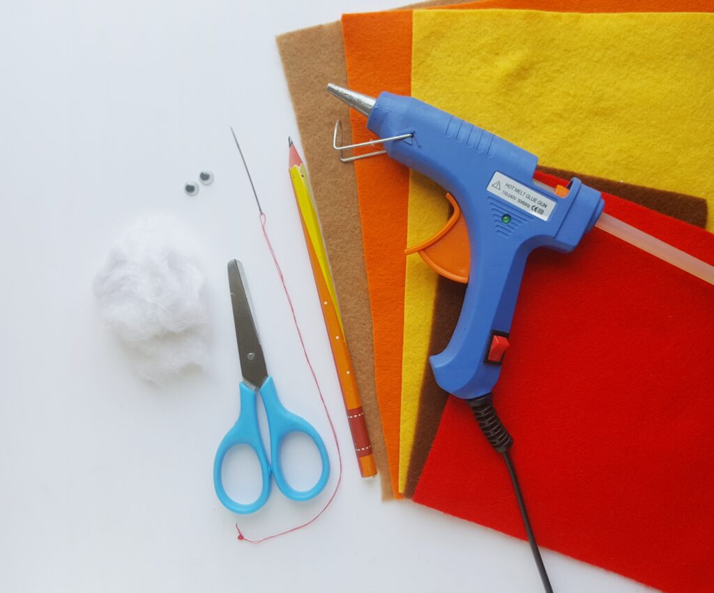 hot glue gun on top of pieces of felt 