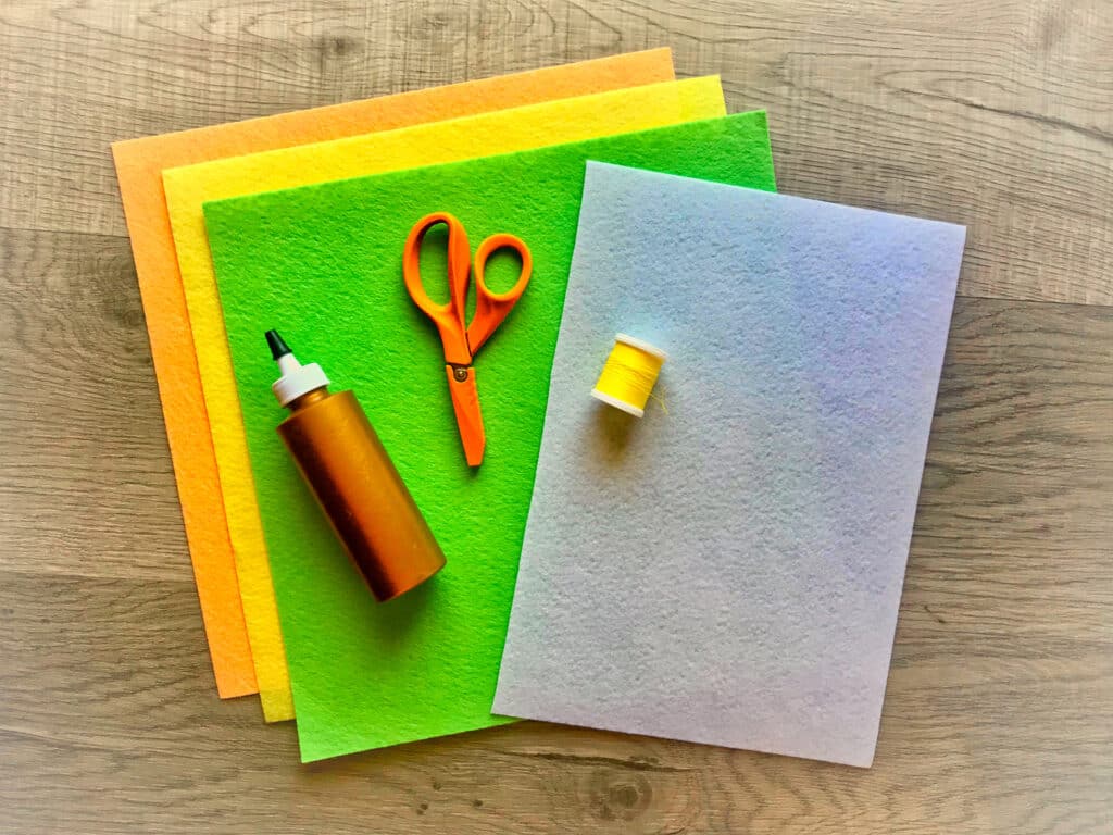 felt sheets with glue and scissors