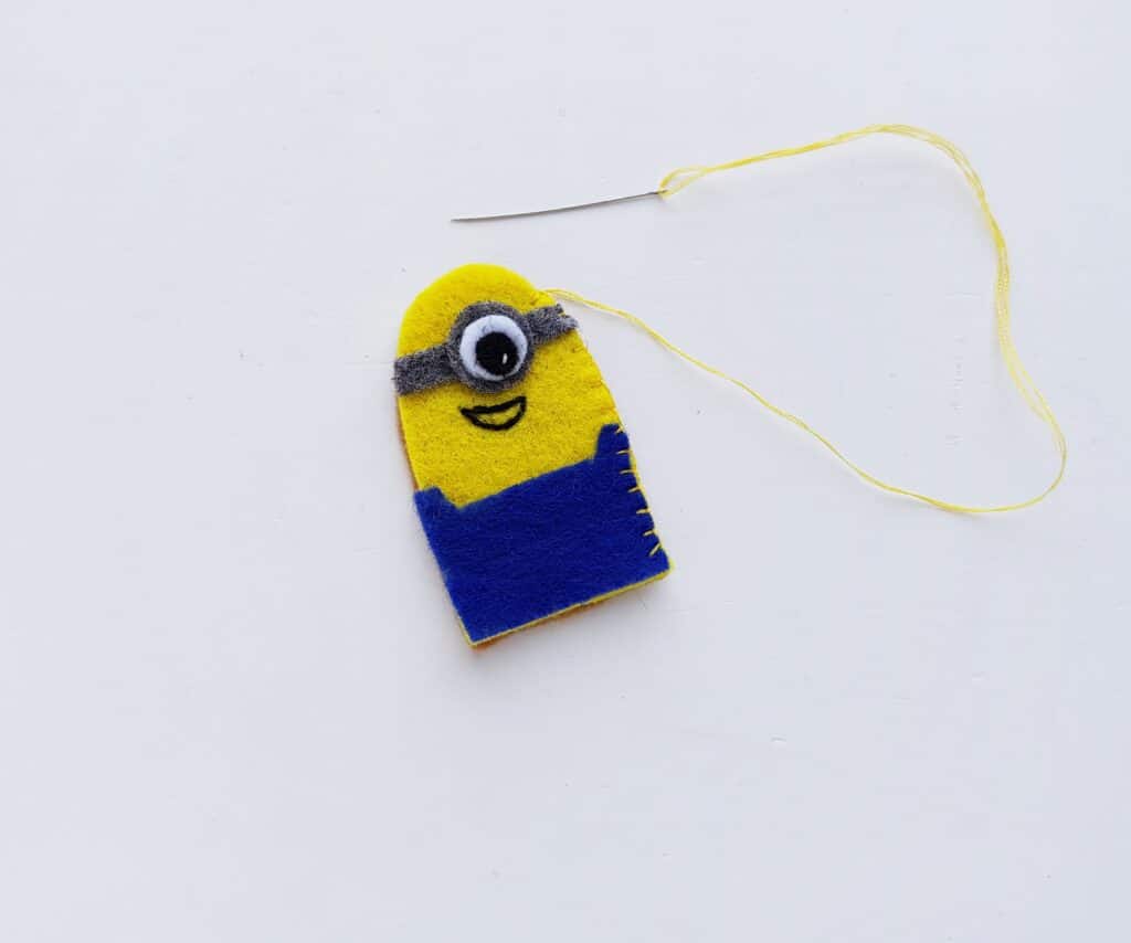 stitching a felt minion together