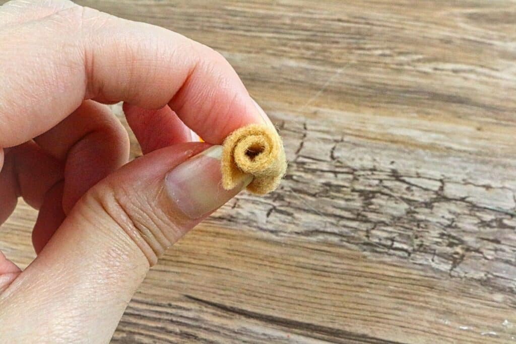 mini felt pumpkin stem roll in hands