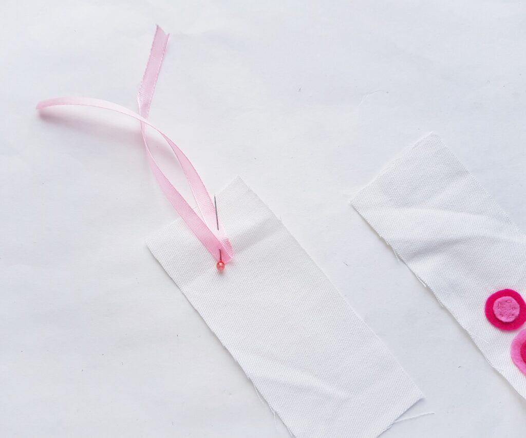 Fabric Bookmark pinning pink ribbon to back panel