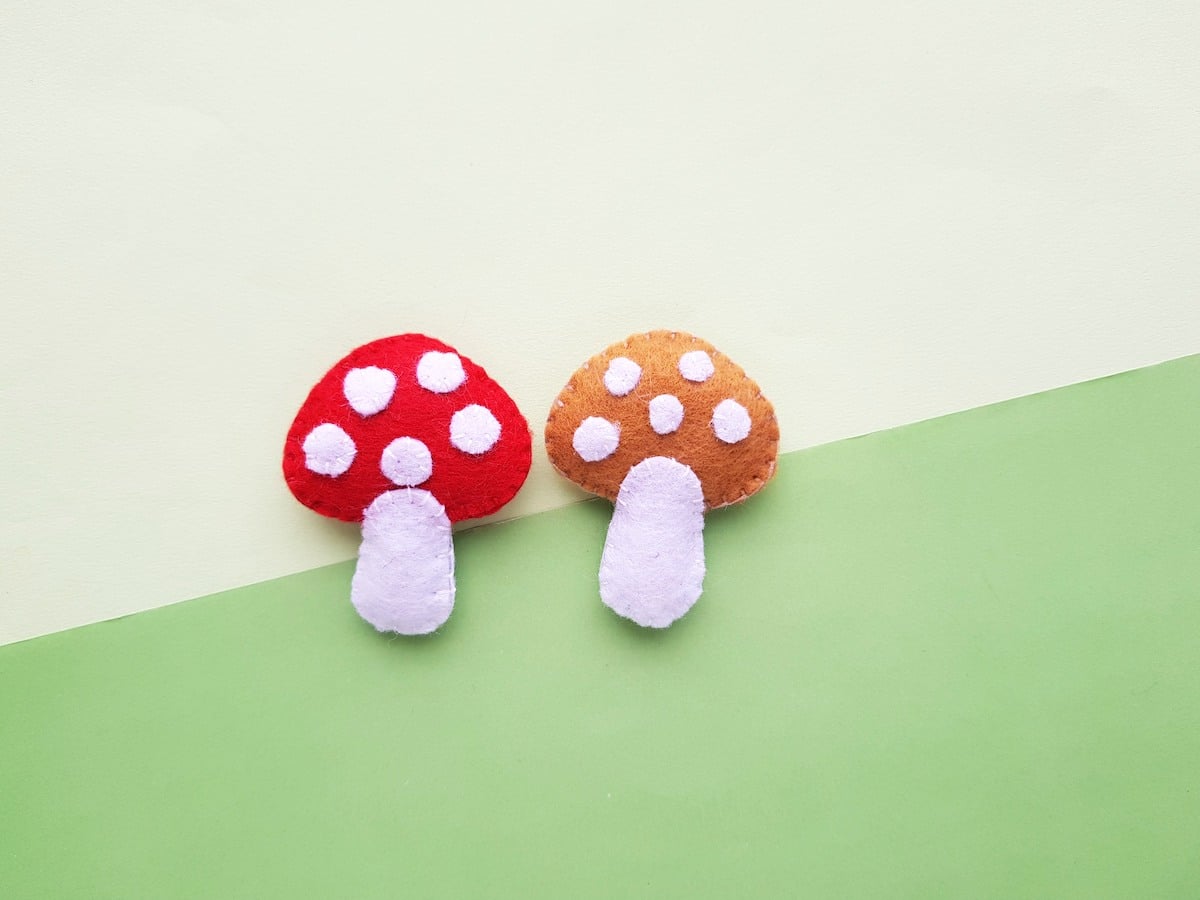 Felt Mushroom Plush completed side by side on green background