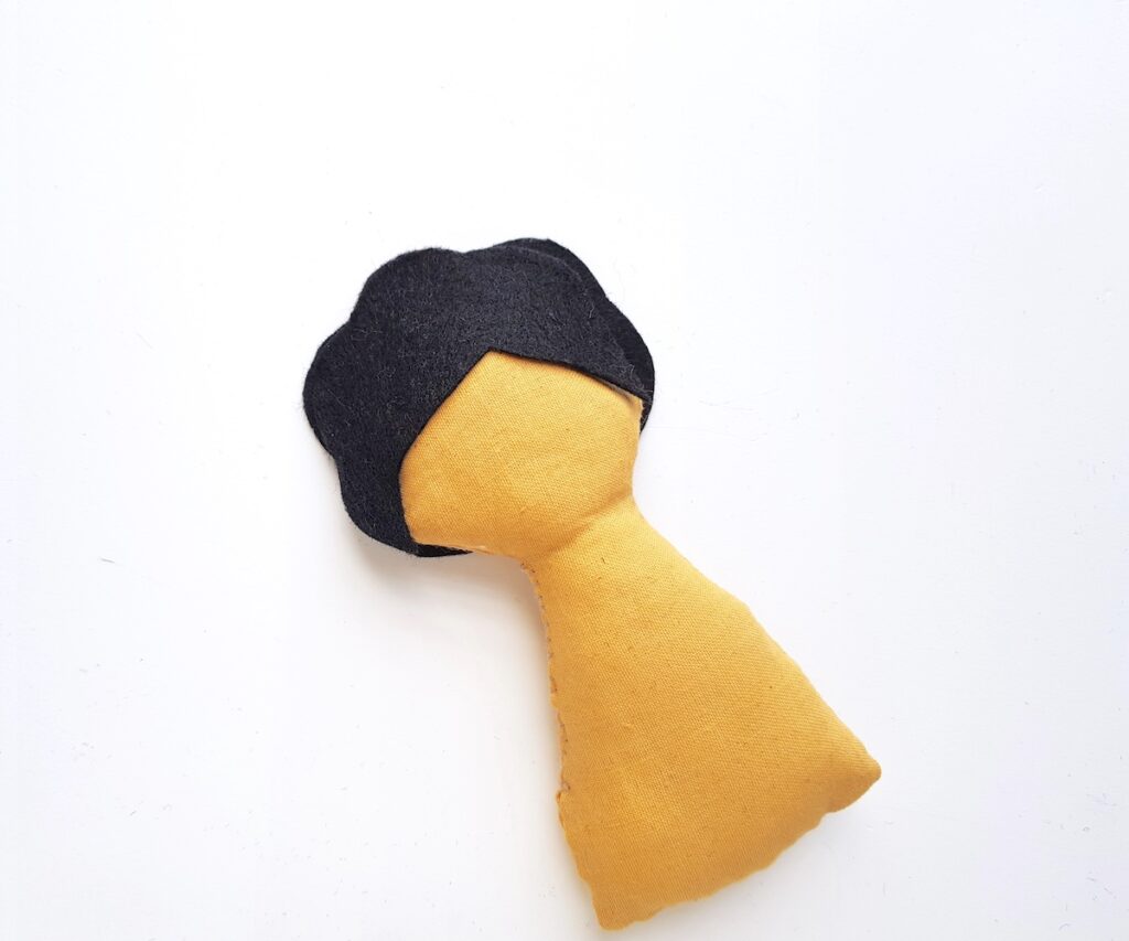 Frida Kahlo doll semi-hair black felt pattern placed on doll body