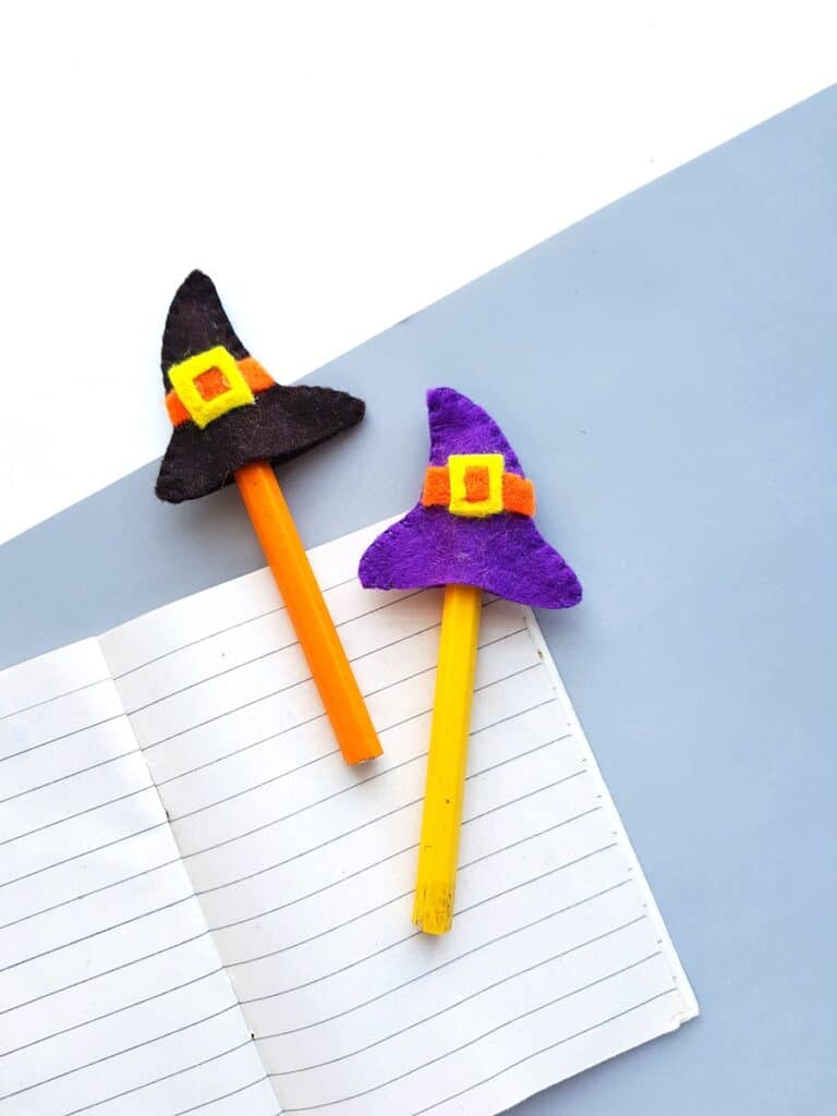 Halloween mini felt witch hat pencil toppers on table