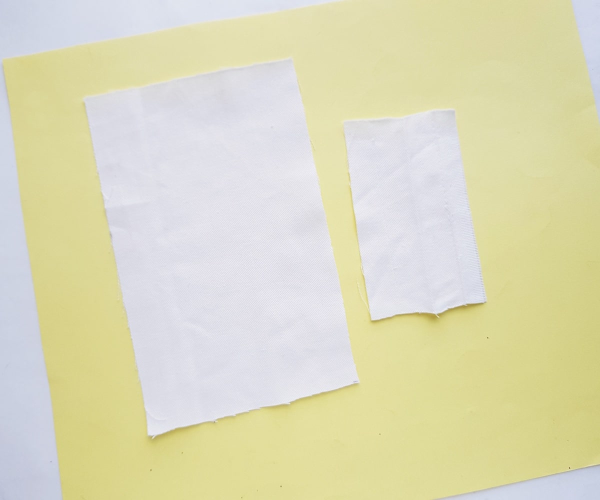 cut pieces of fabric on yellow background