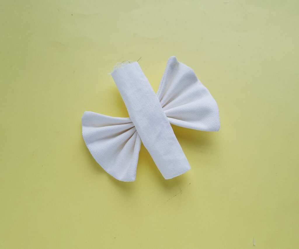 A roll of paper with a bow.