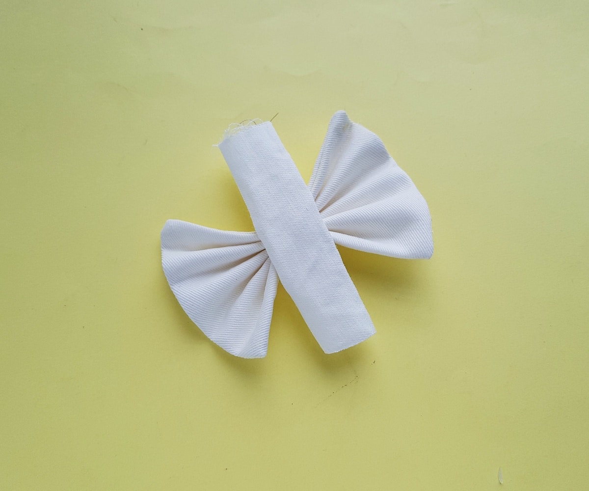 A roll of paper with a bow.