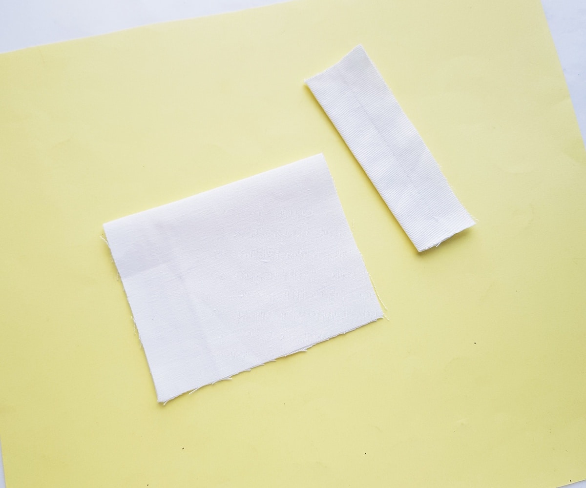 folded pieces of fabric on yellow background