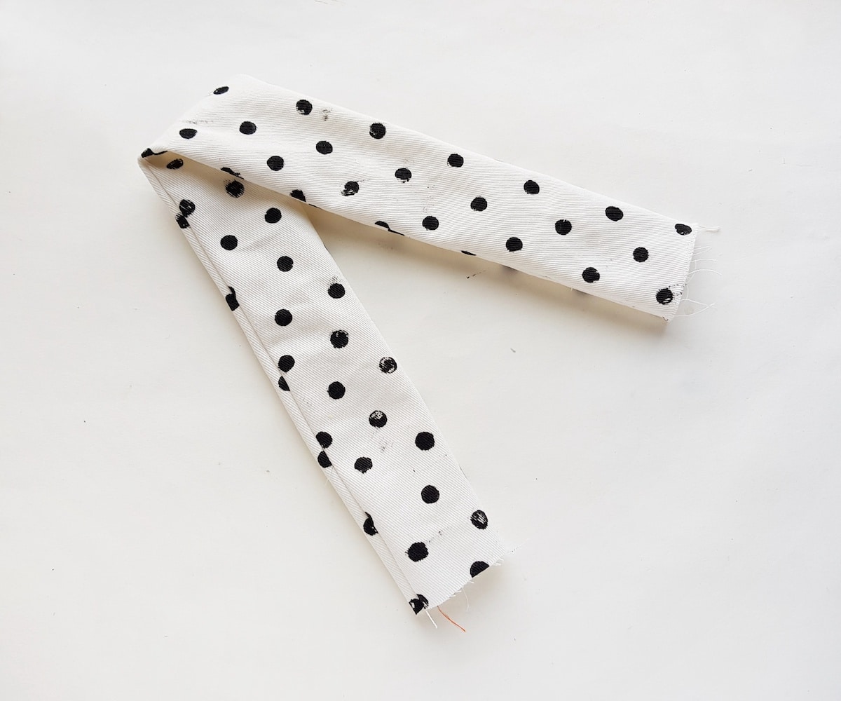A black and white polka dot scarf.
