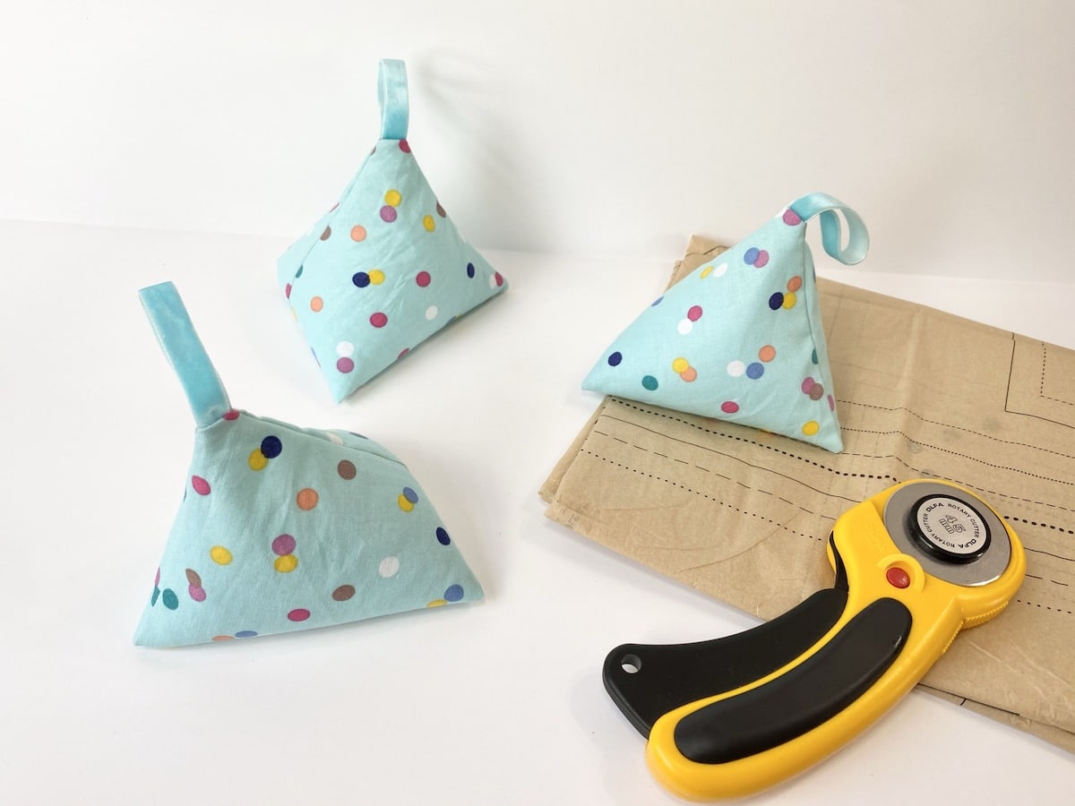 DIY Pattern Weights made from fabric next to sewing pattern