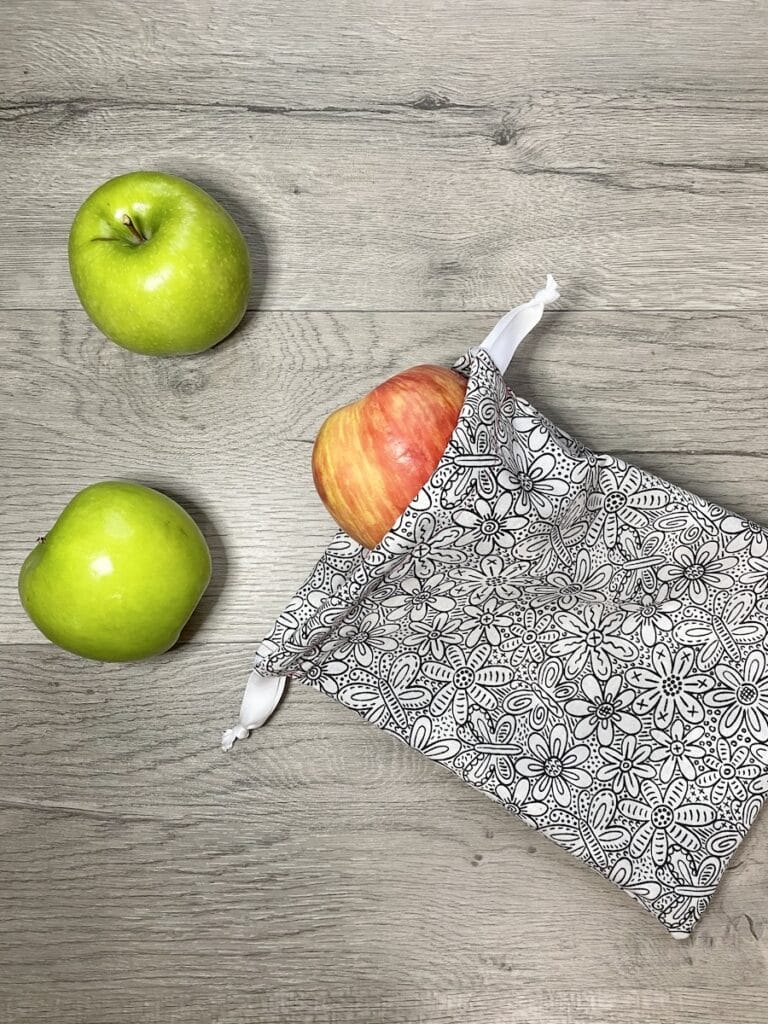 sew a drawstring bag with apples on table