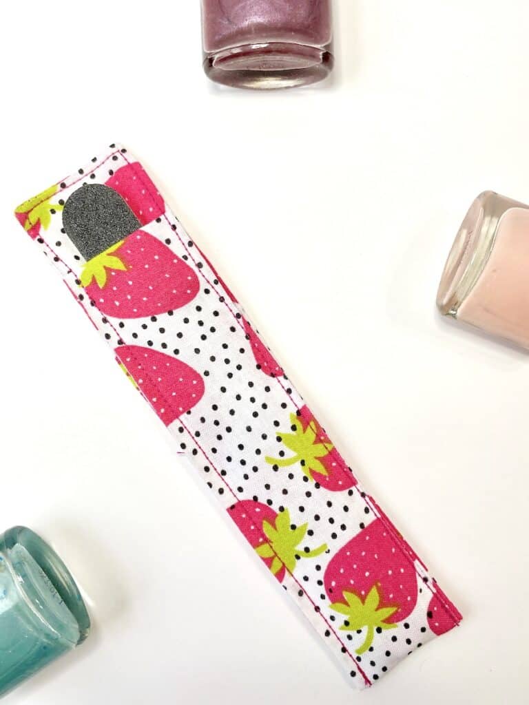 Nail File holder on table with nail polish