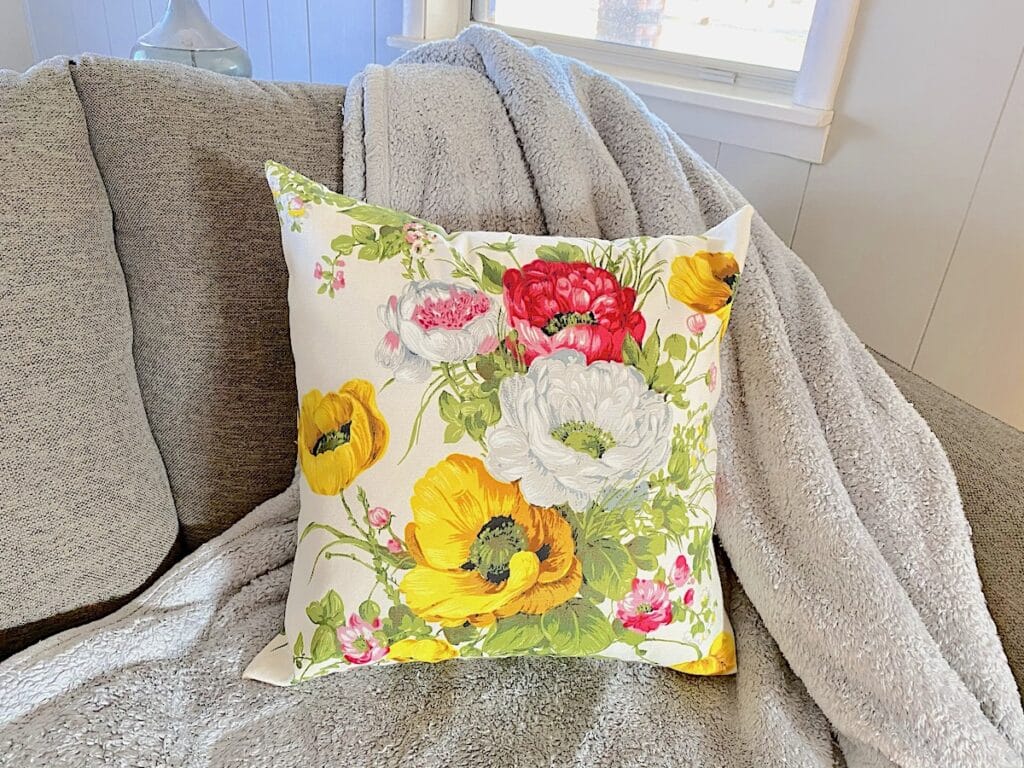 zippered pillow cover on grey couch
