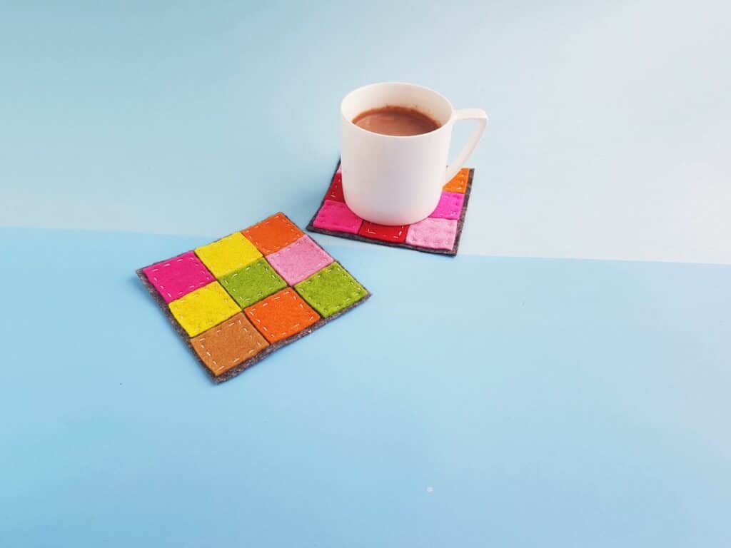 Patchwork Felt Coasters with mug on blue background