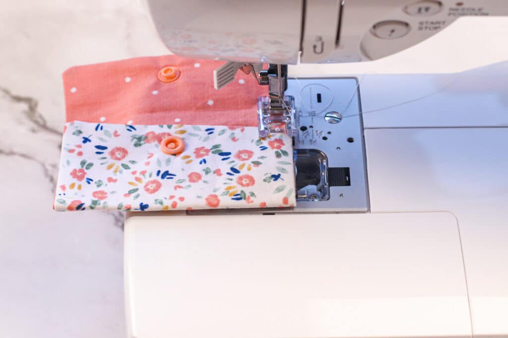 A sewing machine with a piece of fabric on it.