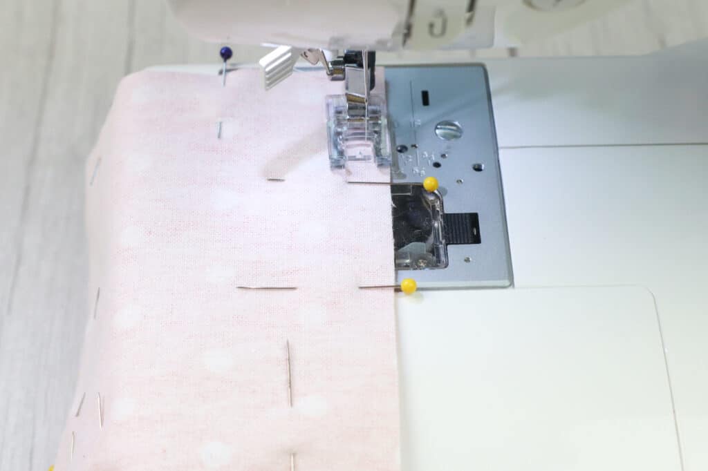 A sewing machine with a pink polka dot fabric, perfect for DIY projects.