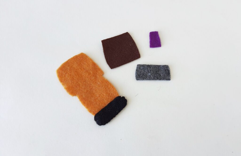 A group of felt pieces on a white surface.