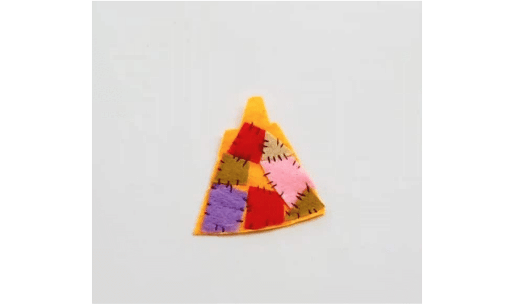 A small piece of felt with a colorful pattern on it.