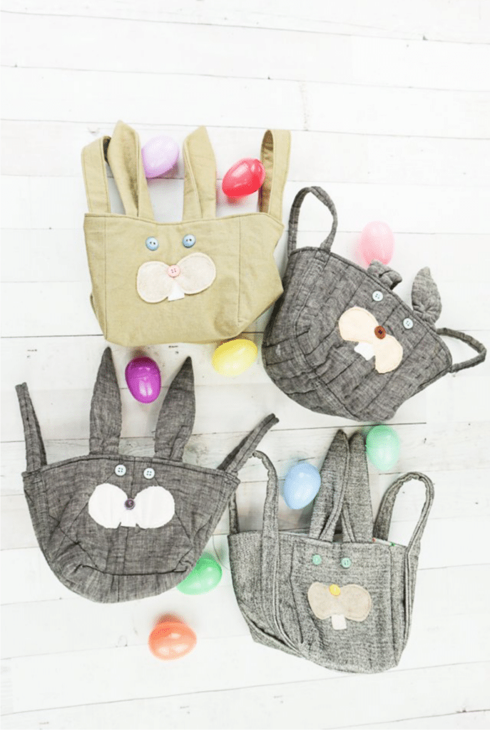 A group of bags with bunny ears and eggs.