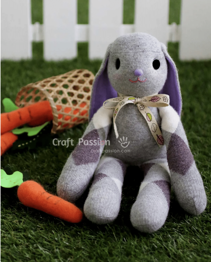 A stuffed bunny with carrots, featuring adorable bunny sewing patterns.