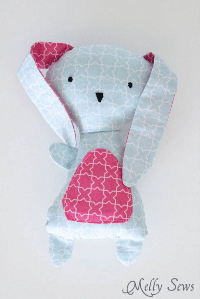 A blue and pink bunny stuffed animal made using bunny sewing patterns.