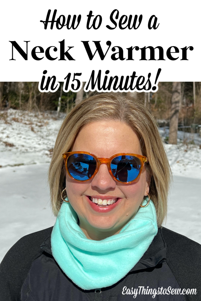 A person sporting stylish sunglasses and a cozy light blue neck warmer enjoys the snowy outdoors. The image boasts, "How to Sew a Neck Warmer in 15 Minutes!" Visit EasyThingsToSew.com for quick and fun projects.