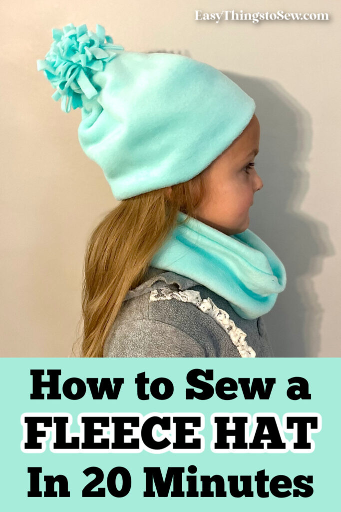 A child in profile wears a cozy light blue fleece hat with a pom-pom and a matching neck warmer. The text reads, "How to Sew Your Own Fleece Hat in Just 20 Minutes.