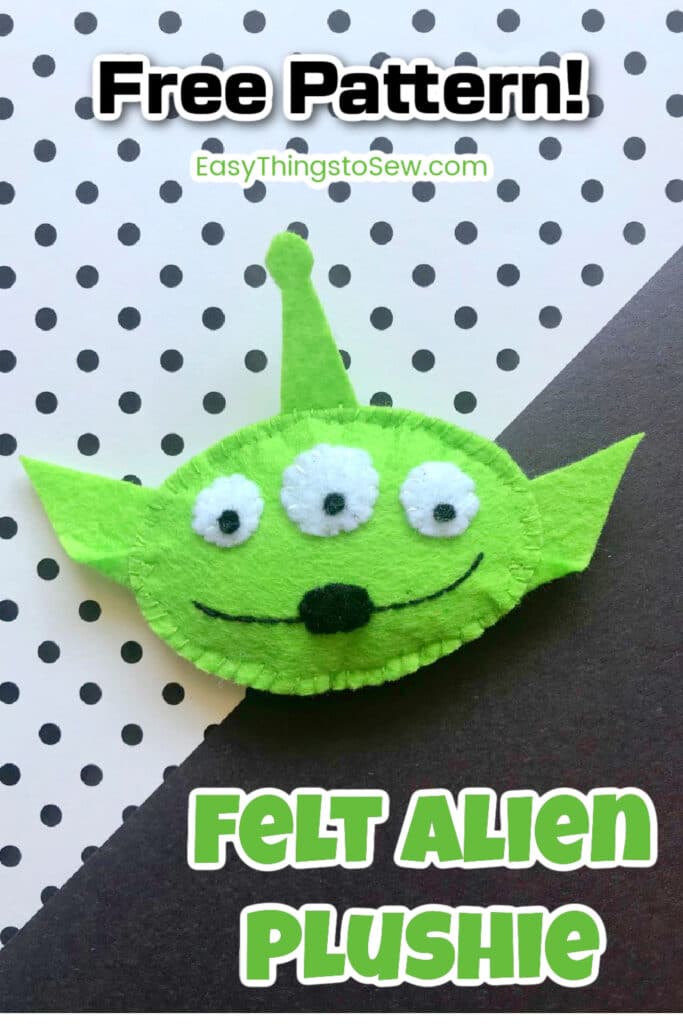 A green felt alien face.