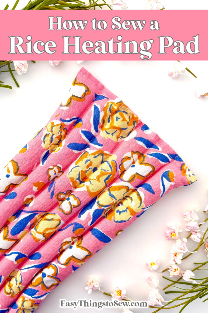 A pink floral rice heating pad rests on a white surface with small white flowers, perfect as a cozy trivet, under the text "How to Sew a Rice Heating Pad.