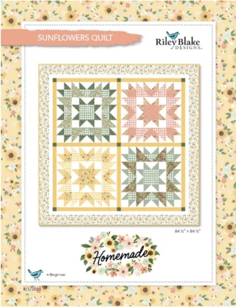 Cover of a "Sunflowers Quilt" pattern by Riley Blake Designs, showing a quilt with four sunflower-inspired blocks in green, yellow, and peach tones on a floral background.