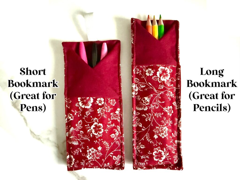 Two red floral fabric bookmark holders are shown: a shorter one holding pens and a longer one holding colored pencils. Labels indicate the short holder is for pens and the long holder is for pencils.