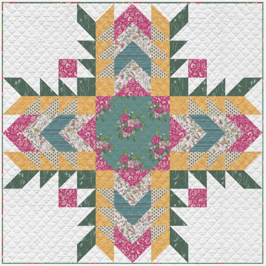 A quilt with a symmetrical geometric pattern in green, pink, yellow, and floral prints on a white quilted background.